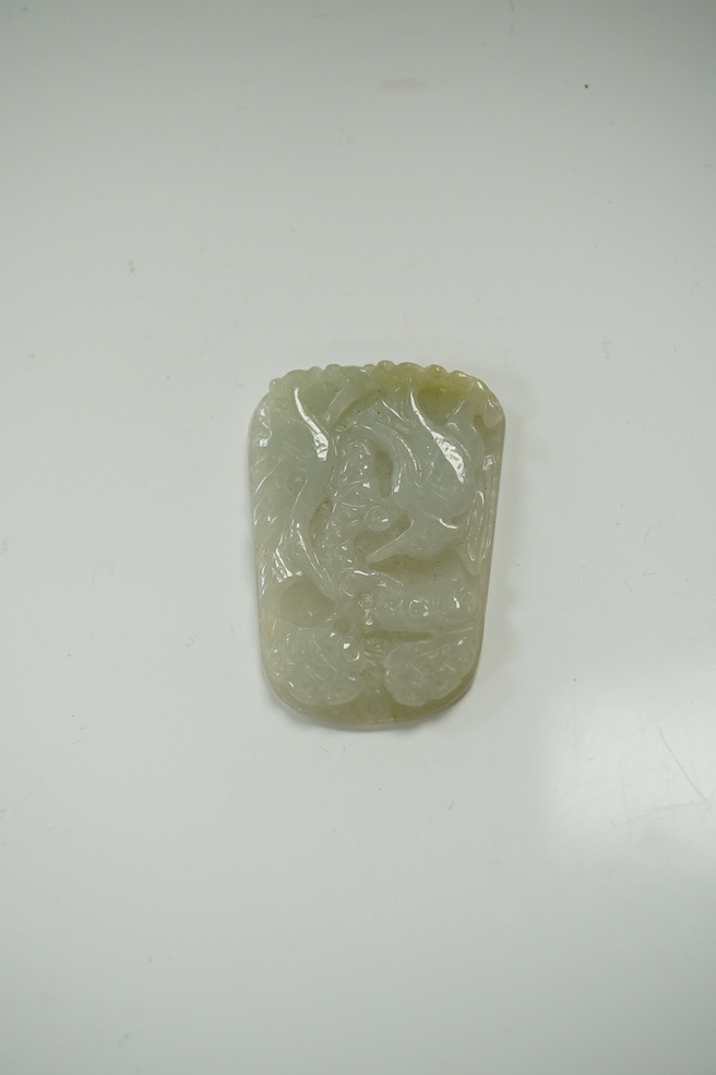 A Chinese jadeite pendant and a carving of a bud, largest 6cm high (2). Condition - good